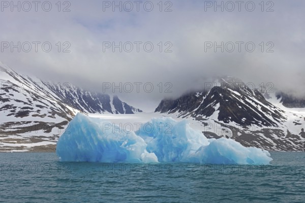 Iceberg melting in summer in Magdalenefjorden, fjord in Albert I Land on Svalbard, Spitsbergen,