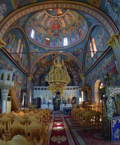 Interior of the church of Panagia Vrisiani with church dome, frescoes and magnificent chandelier in