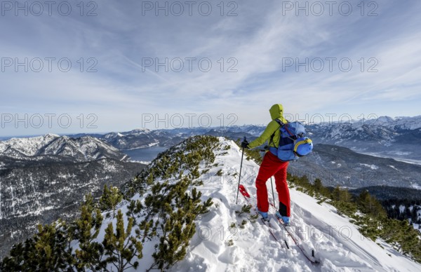 Ski tourer at the summit of Simetsberg, mountain panorama, Estergebirge, Bavarian Prealps, Bavaria