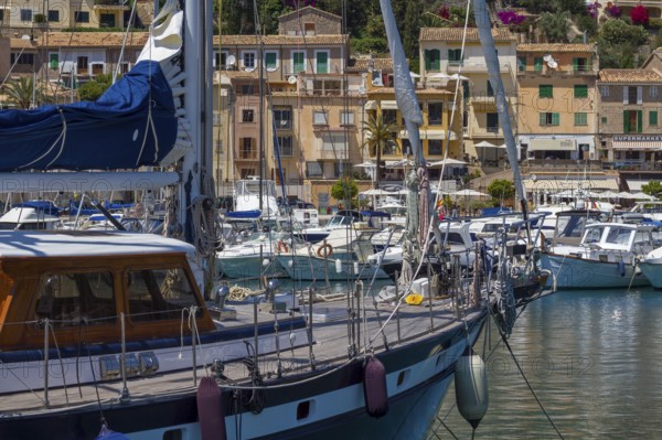 Sailing boats in the harbour of a sunny Mediterranean village, Port de Sóller, Majorca, Balearic