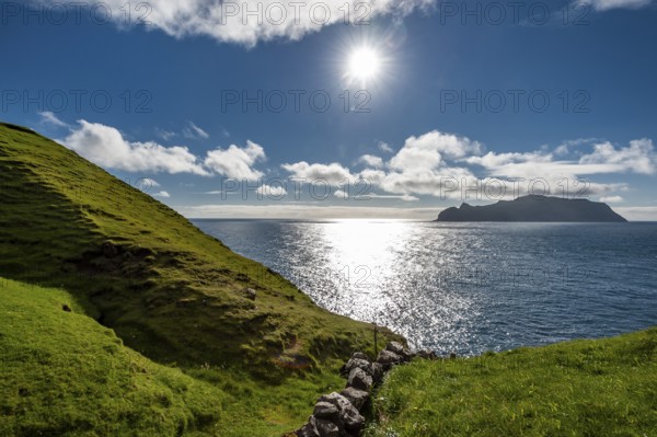 View of the island of Mykines, old stone wall, Gásadalur, Vágar, Faroe Islands, Denmark, Europe