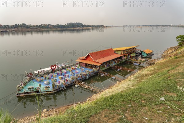 Floating restaurant on the Mekong and the banks of the Mekong in Nong Khai and Laos, Thailand, Asia