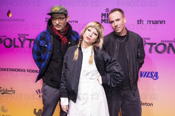 Andy Penn, Mieze Katz and Robert Bob Schütze from the band MIA. on the red carpet in front of the