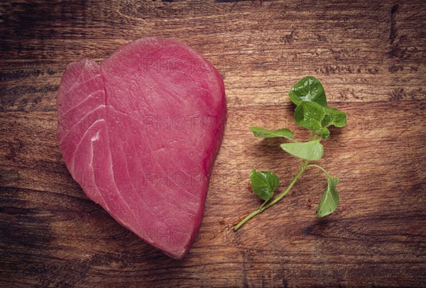 Fresh red tuna fillet, for steak, raw, top view, on a cutting board, no people