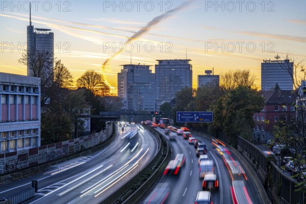 Evening traffic, partly with traffic jams, slow-moving traffic on the A40 motorway, skyline of