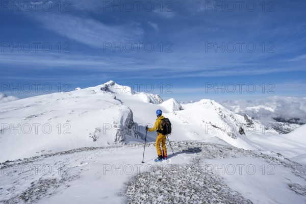 Ski touring in mountain landscape with snow, summit Wildhorn with Tungel glacier, Bernese Alps,