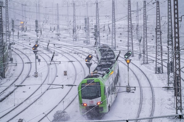 Winter weather, heavy snowfall, railway tracks in front of Essen main station, S-Bahn train, North