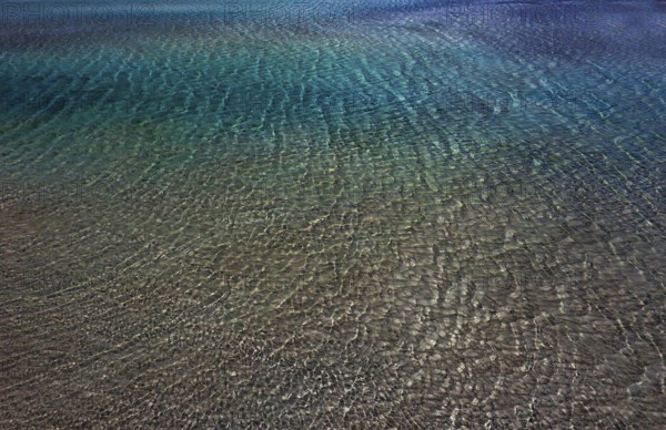 Drone shot, glittering water surface on the beach of Elafonisi, west coast, Crete, Greece, Europe