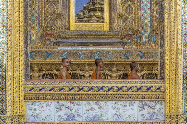 Wat Phra Kaeo temple, royal palace. Royal chapel with Buddhist monks and novices. Bangkok,