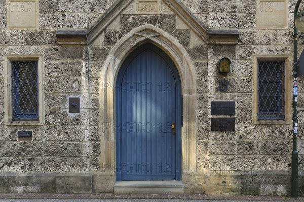 Entrance, blue wooden door, lodge sign, writing, letters, information board at the Marchtaler Hof,