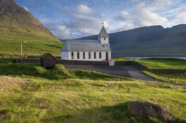 White church with mountains and green fields, Vidareidi, Vidoy Island, Viðareiði, Viðoy Island,