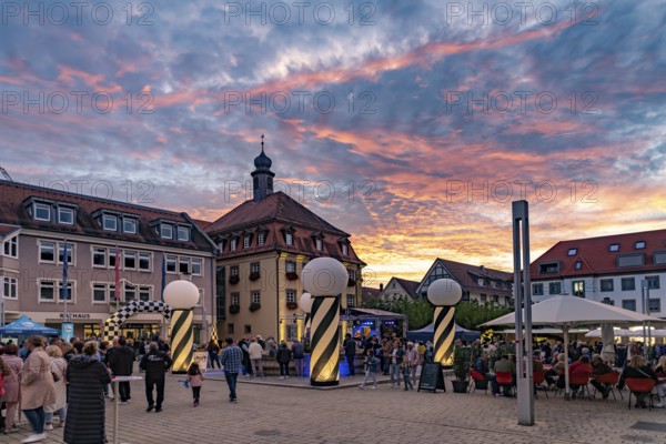 Sunset at the market square during the Shopping Lights event in Neckarsulm, Baden-Württemberg,