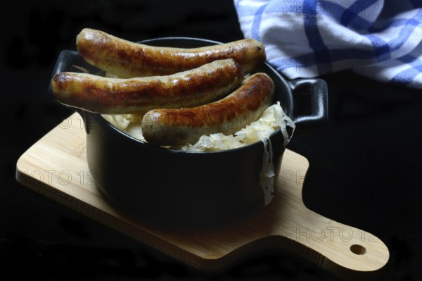 Nuremberg sausages with sauerkraut in a pot, Rostbratwurst, Germany, Europe