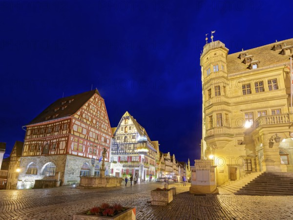 Town hall on the market square and half-timbered houses in Herrngasse in the old town of Rothenburg