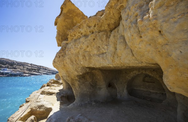 View from the rock caves to the beach of Matala, south coast, Crete, Greece, Europe