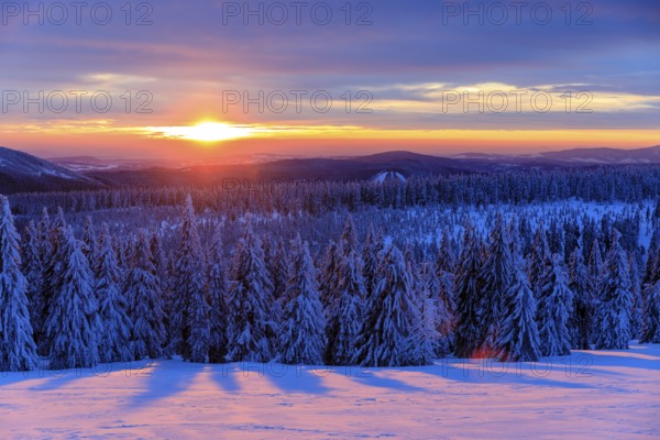 Sunset and winter landscape at the Wossecker Baude above Harrachsdorf in the Giant Mountains, Czech