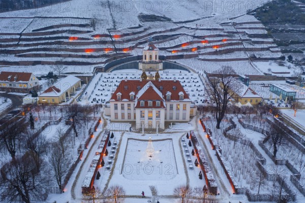 Aerial view of Wackerbarth Castle with castle park, belvedere and vineyards with snow and Christmas