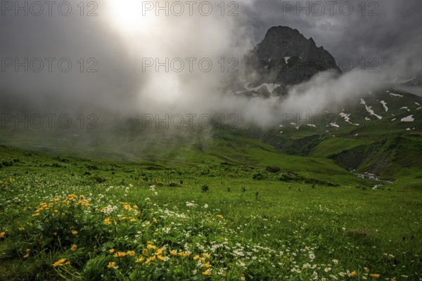 Peaks in the morning light and alpine landscape with dramatic clouds, Lech, Lechquellengebirge,