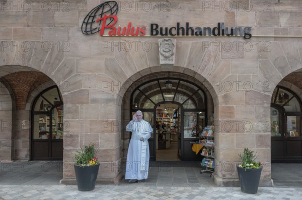 Life-size statue of Pope Francis in front of the Paulus bookshop, Nuremberg, Middle Franconia,