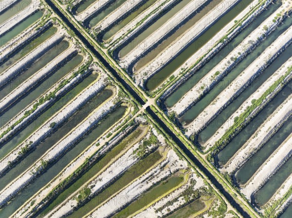 Saline ponds at the salt works of Isla Cristina. Aerial view. Drone shot. Huelva province,