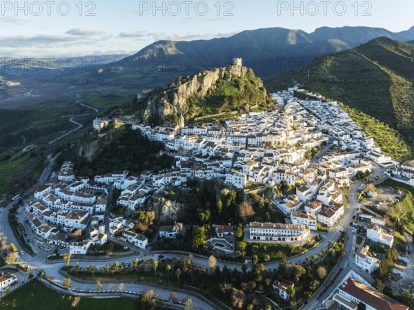 The White Town of Zahara de la Sierra below a Moorish castle. Aerial view. Drone shot. Cádiz