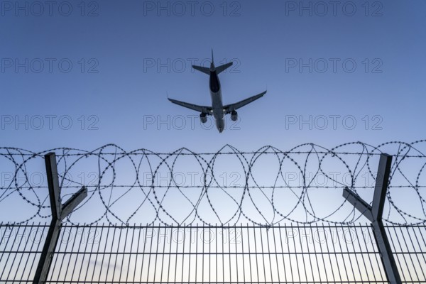 Symbolic image security at the airport, outer fence at Düsseldorf International Airport, steel wire