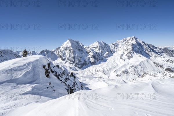 Mountain panorama with snow-covered mountain landscape in winter, view of mountain peaks