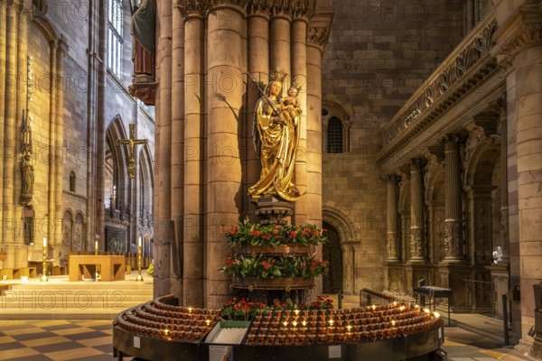 Madonna and sacrificial candles in the interior of Freiburg Minster, Freiburg im Breisgau, Black