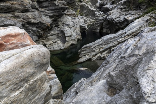 Rocks, granite rock formations in the Maggia River near Ponte Brolla, in the Maggia Valley, Valle