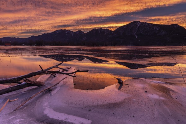 Dawn, mountains reflected in lake, clouds, ice, frozen, winter, Lake Kochel, view of Rabenkopf,