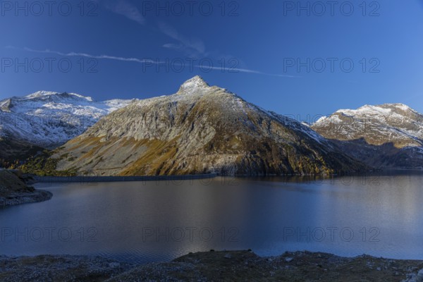 Kölnbrein reservoir and the Oberlecherspitzen mountain on a bright sunny morning. Seen from the