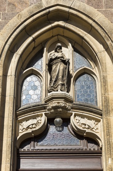 Christ with the Lamb, sandstone figure above the entrance to St Martin's Church, Weinböhla, Saxony,
