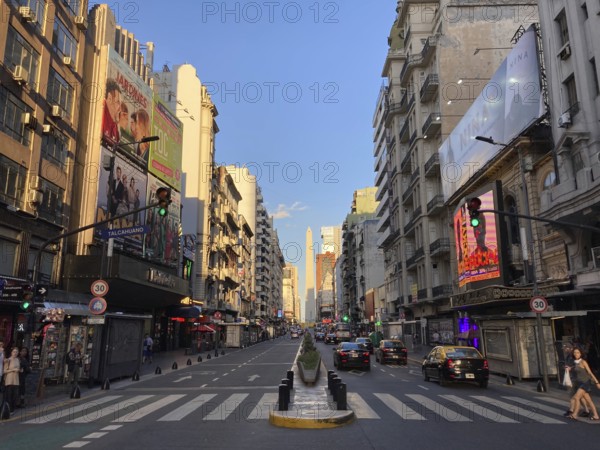 Avenida Corrientes with the obelisk in the city centre in the evening light, Buenos Aires,