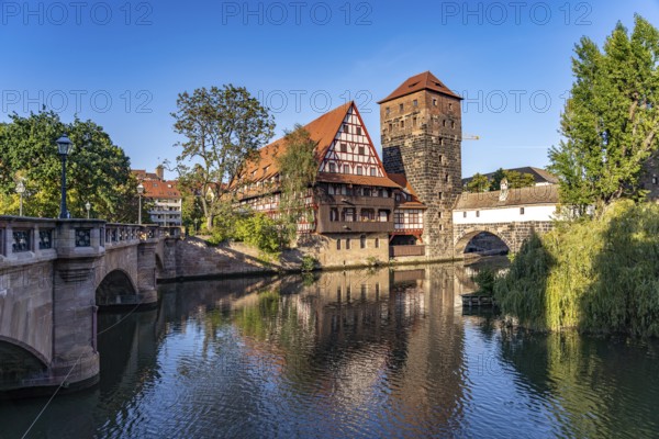 Half-timbered house Weinstadel and water tower on the Pegnitz in Nuremberg, Bavaria, Germany,