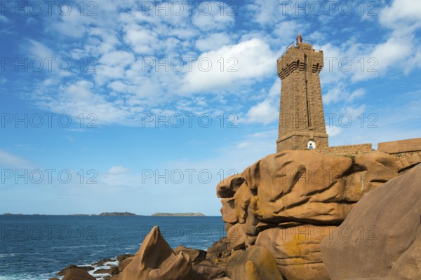 Lighthouse on rocky coast in front of a clear, cloudy sky, Phare de Men Ruz, Ploumanac'h,