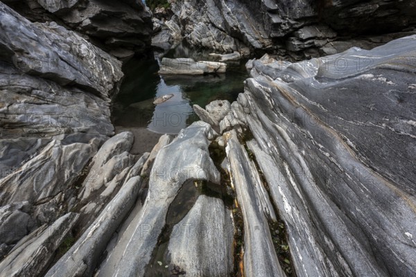 Rocks, granite rock formations in the Maggia River near Ponte Brolla, in the Maggia Valley, Valle