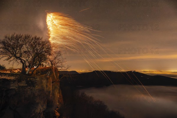 New Year's Eve fireworks 2024, on the Breitenstein, Swabian Alb near Ochsenwang. Sea of fog in the