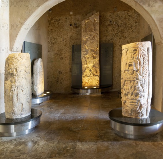 Carved stonework stelae display inside museum of Mayan Archaeology, Campeche city, Mexico, Central