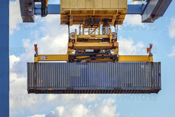 Duisburg, North Rhine-Westphalia, Germany, containers are loaded onto a goods train in the port of