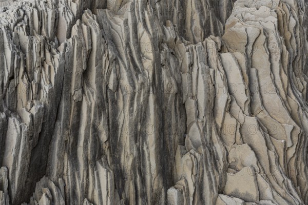 Reynisfjara Beach with Basalt rocks (Stuolabrrg) and the rock needles (Haidrangur), close to Vik i