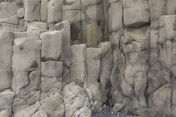 Reynisfjara Beach with Basalt rocks (Stuolabrrg) and the rock needles (Haidrangur), close to Vik i