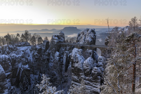 Snow-covered Bastei Bridge in the morning, in the background the Lilienstein, Saxon Switzerland,