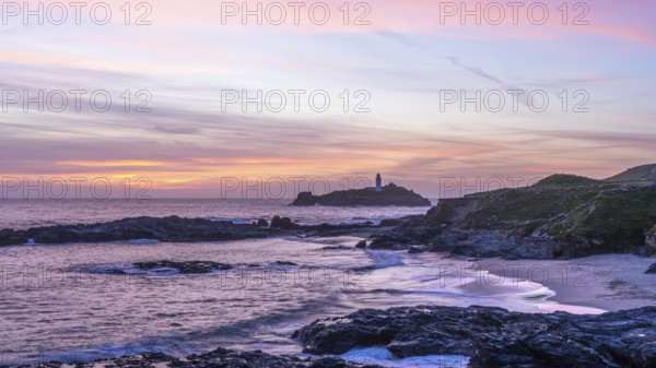 Godrevy Lighthouse, the lighthouse of Godrevy on Godrevy Island in the sea. In the evening at