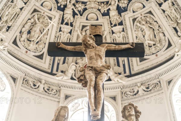 Crucifix and Baroque stucco work on the vault of the west choir in the interior of St Peter's