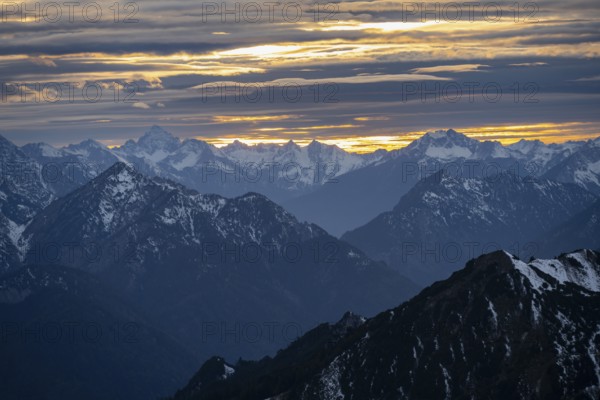 Mountain panorama with snow at sunset, in autumn, view from Kramerspitz, Bavarian Prealps, Bavaria,