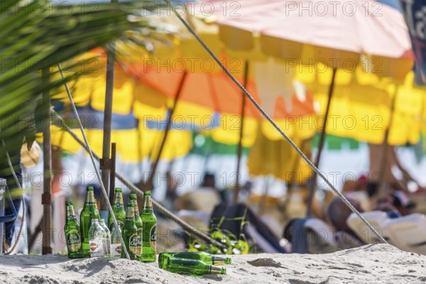 Overtourism in Thailand. Mass tourism on the sandy beach of Patong, the deckchairs are packed