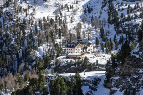Zufallhütte mountain hut, view of the Martell Valley, snow-covered mountain landscape in winter,