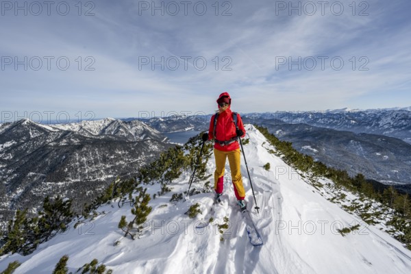 Ski tourer at the summit of Simetsberg, mountain panorama, Estergebirge, Bavarian Prealps, Bavaria