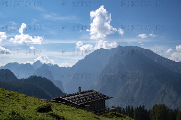Rustic alpine hut on the Priesbergalm with a view of the Watzmann, Berchtesgaden National Park,