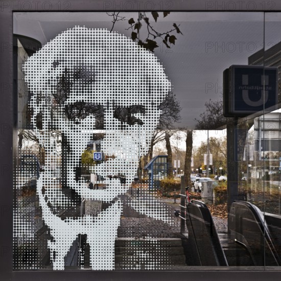 Portrait of Theodor Heuss on the glass pane at the underground exit Heussallee and Museumsmeile,